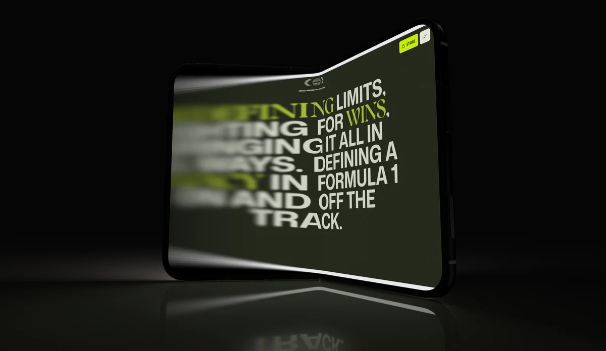 A folding phone at an angle, its near edge sharp and the far side soft with depth of field.