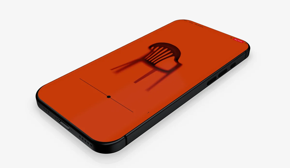 An orange phone lying at an angle on a white ground, casting a soft shadow.