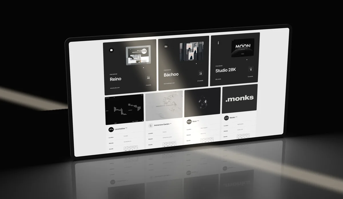 A browser window of dark thumbnails standing on a glossy black floor.